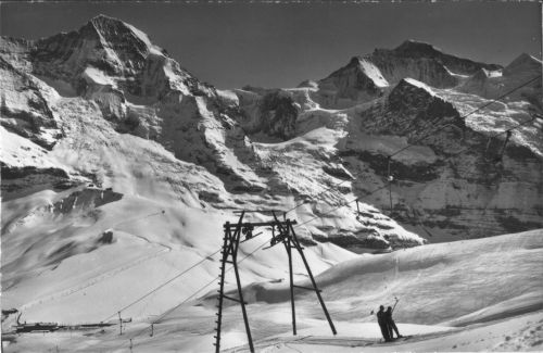 Lauberhorn-Skilift, System Constam, ca. 1940er-Jahre, hier noch mit Holzmasten (Postkarte, Photo-Verlag Gyger, Adelboden, Nr. 8746, "Kleine Scheidegg, Mönch u. Jungfrau, Lauberhorn Skilift") - Postkarte in Wengen gekauft im März 2006
